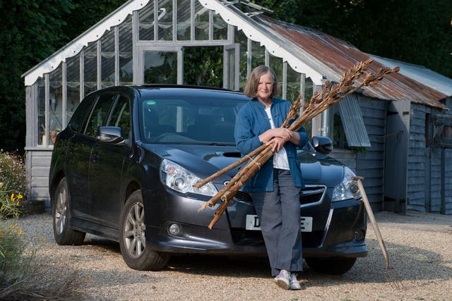 Anna and her trusty Subaru Legacy at her home in Dorset