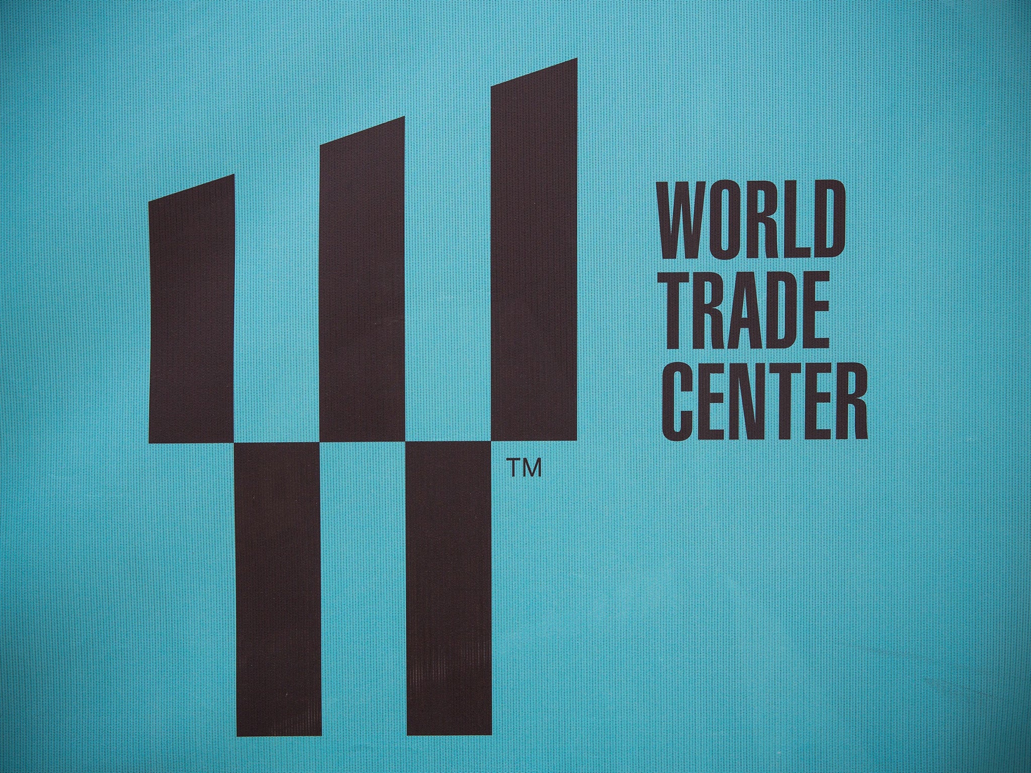 The new World Trade Center logo is seen on a fence outside the Ground Zero construction zone in New York City