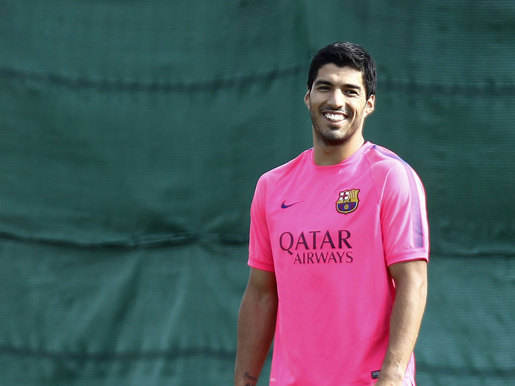 Luis Suarez is all smiles during his first Barcelona training session