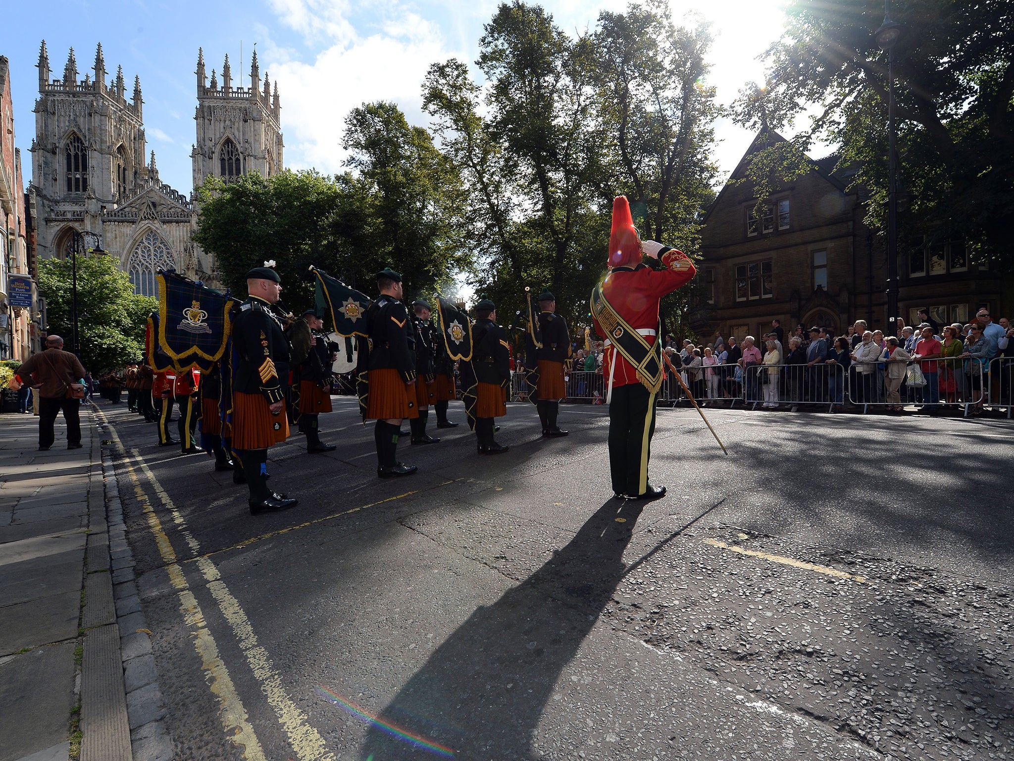 The Royal Dragoons Guard march past York Minster as they parade through the City ahead of a service in the Minster as part of the WWI Commemorations