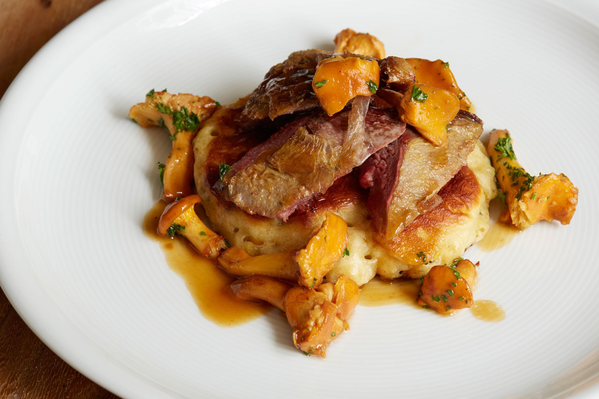 Breast of grouse with corn drop scones and girolles