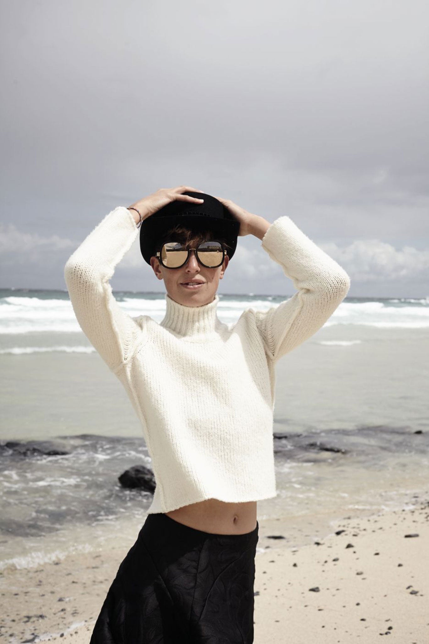 Bryony wears sweater, £490 and skirt, £290, both by Marni, marni.com; hat, £980, by Chanel; sunglasses, £695, by Linda Farrow