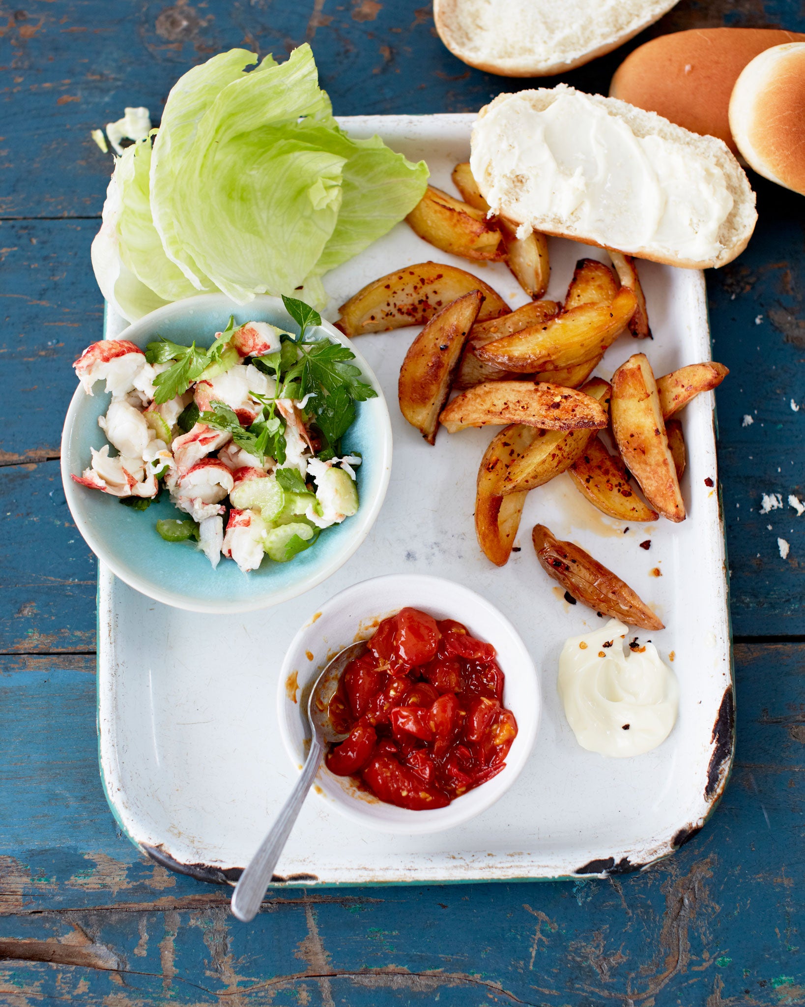 Serve up everything on individual plates so guests can put together their own lobster rolls, with a chilli relish and chips on the side