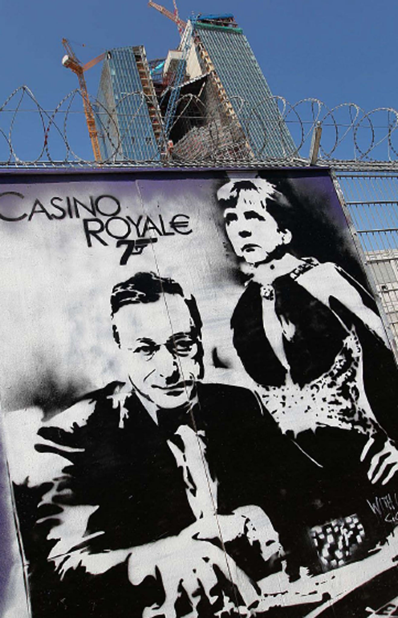 In graffiti next to the new ECB building in Frankfurt, Mario Draghi and German Chancellor Angela Merkel were depicted as gambling with the eurozone's fortunes