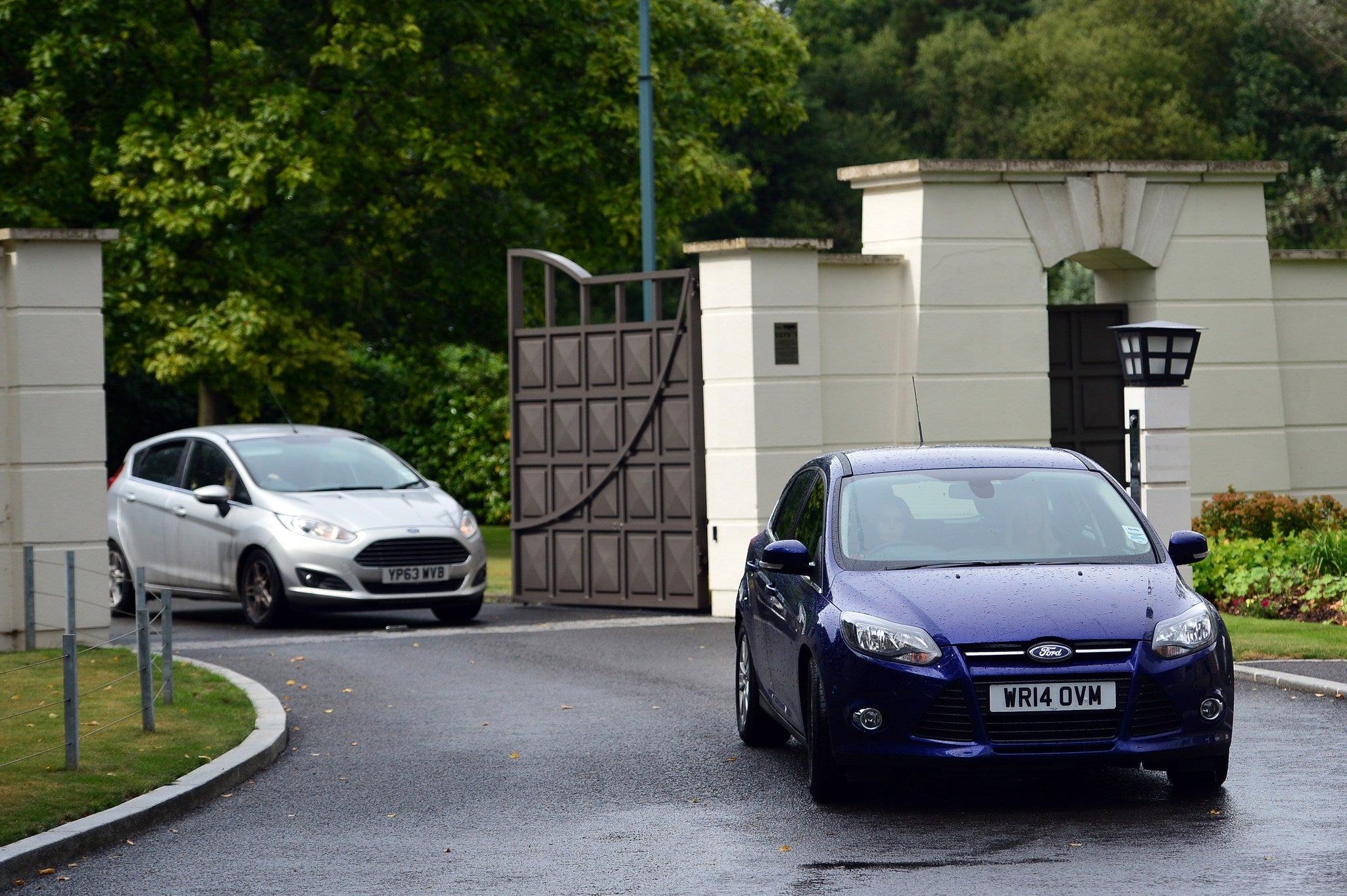 A convoy of cars leave Sir Cliff's home on Thursday