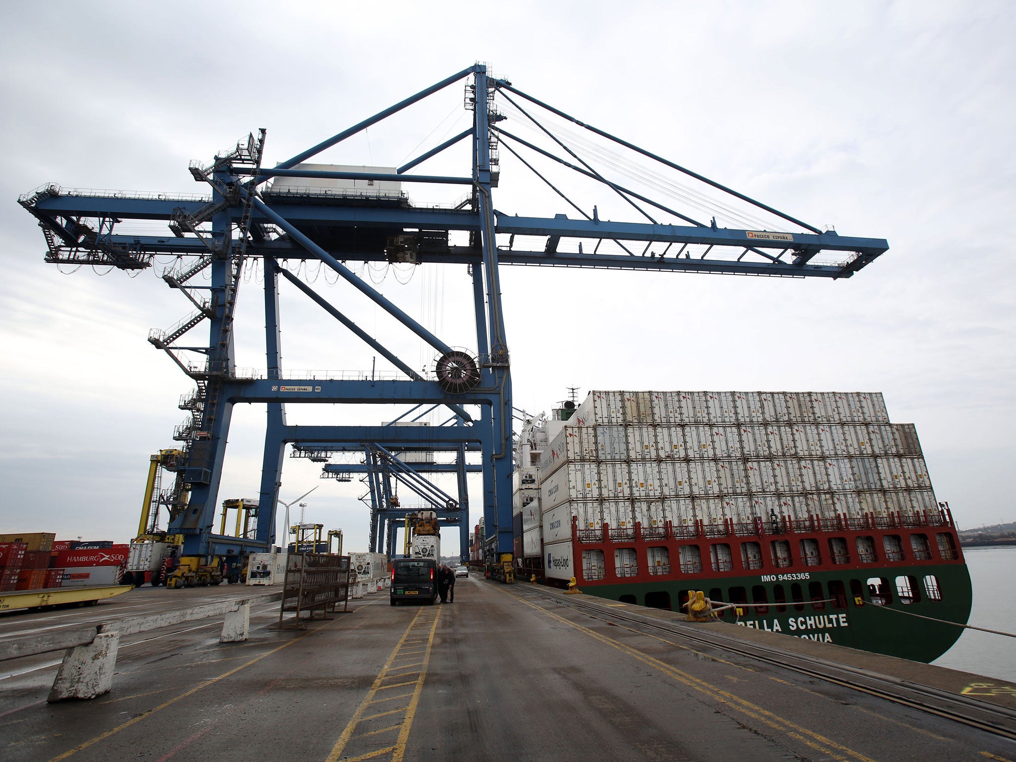 File photo dated 31/3/2014 of a crane along the quay side at Tilbury Docks in Essex. A man has died and other people have been taken to local hospitals with "significant health problems" after 31 adults and children were found inside a shipping container