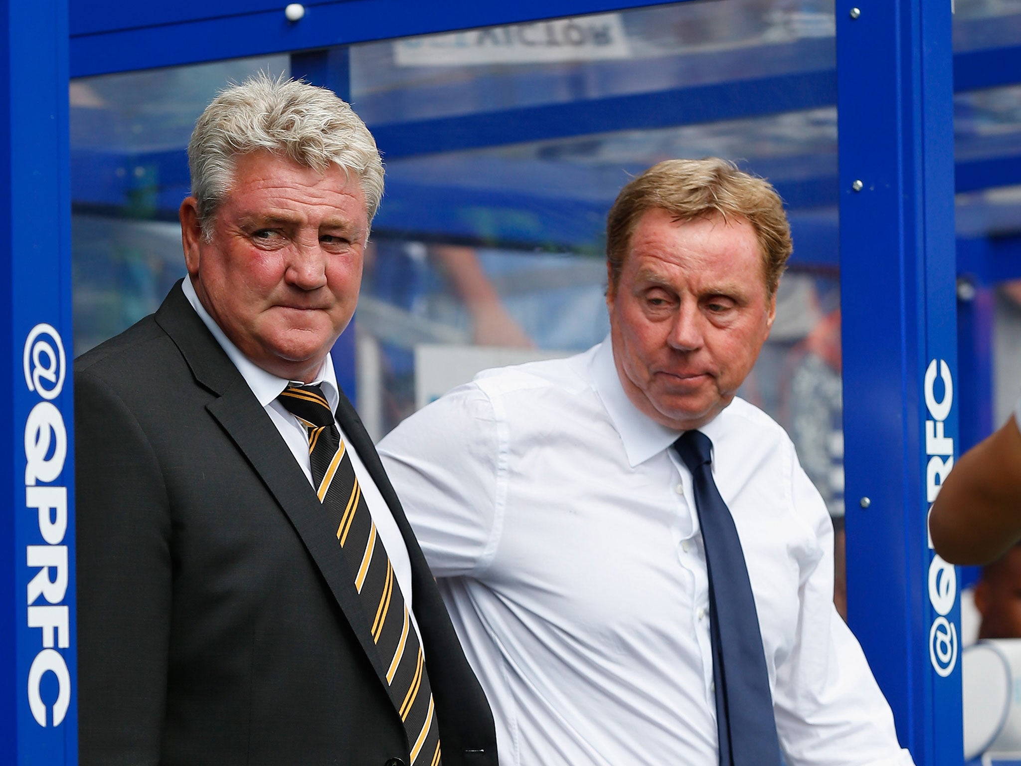 The two managers Steve Bruce (left) and Harry Redknapp watch the action unfold at Loftus Road
