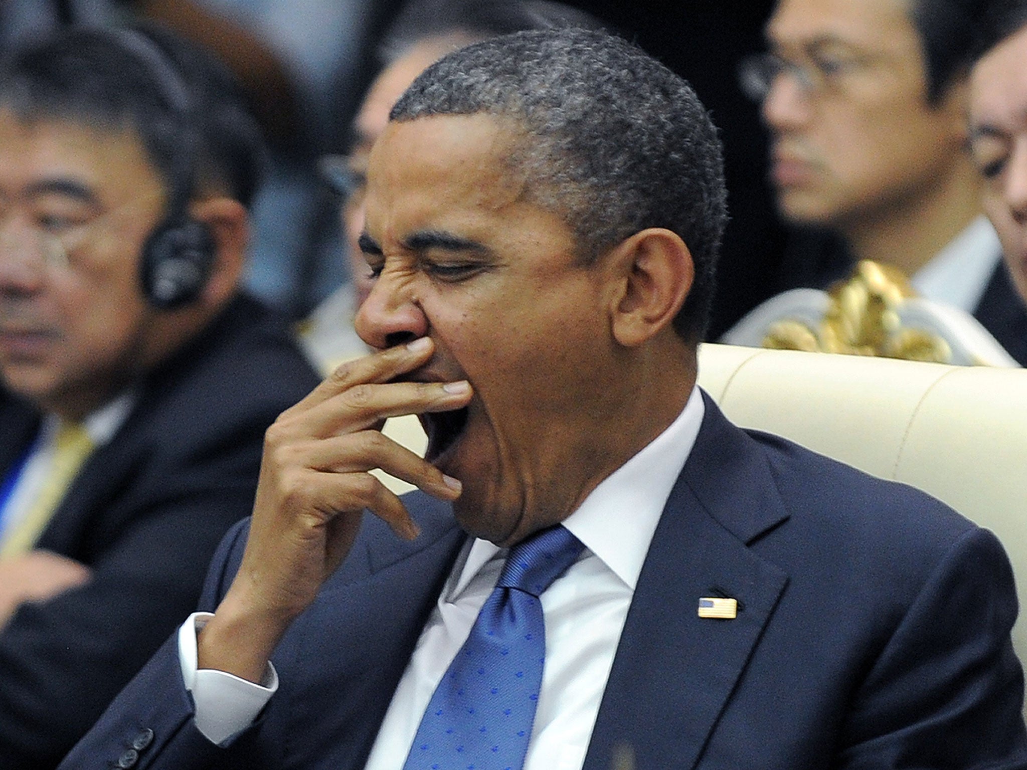 Barack Obama yawns at an East Asian Summit Plenary Session at the Peace Palace in Phnom Penh on November 20, 2012.