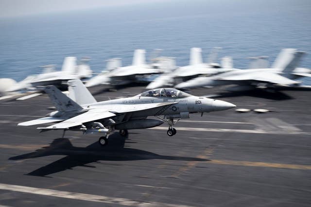 An F/A-18C Hornet coming from Iraq lands on the flight deck of the US navy aircraft carrier USS George H.W. Bush on August 15, 2014 in the Gulf 