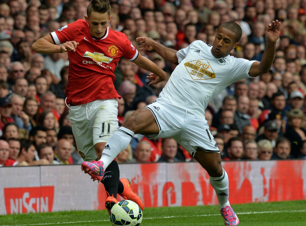 Adnan Januzaj competes for the ball with Wayne Routledge