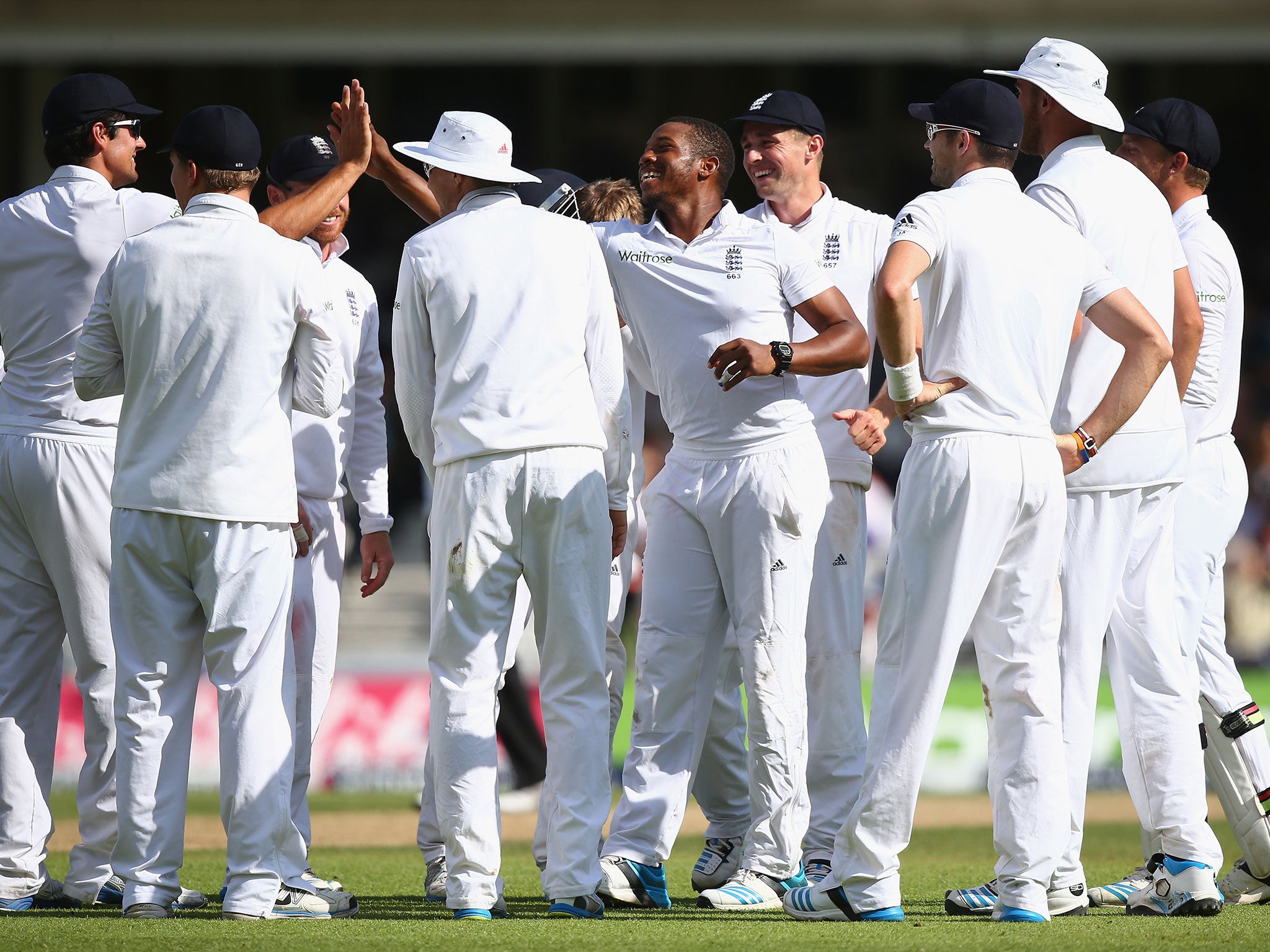 England's Chris Jordan (centre) celebrates with his team-mates after taking the wicket of Ravichandran Ashwin