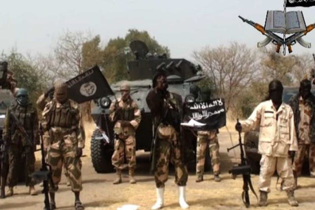 Boko Haram, pictured here in a still from one of their previous videos, have reportedly freed 27 hostages in Cameroon