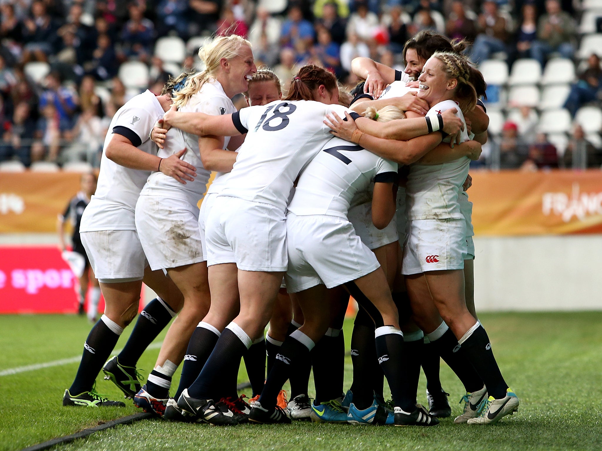 England celebrate after Emily Scarratt scores a try during the IRB Women's Rugby World Cup 2014 Final between England and Canada