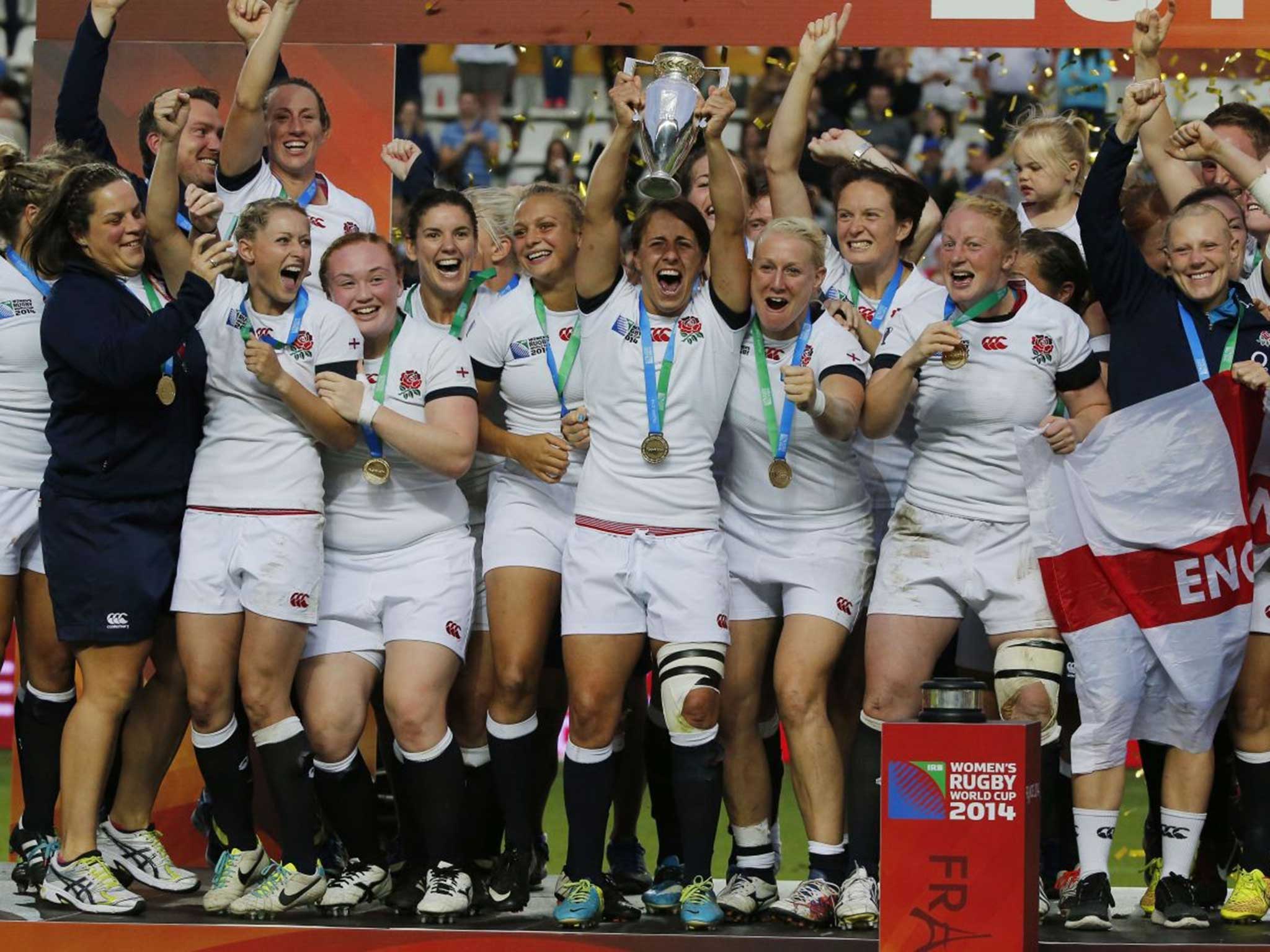 The England captain Katy Mclean lifts the World Cup trophy after her side’s win over Canada in the final in Paris