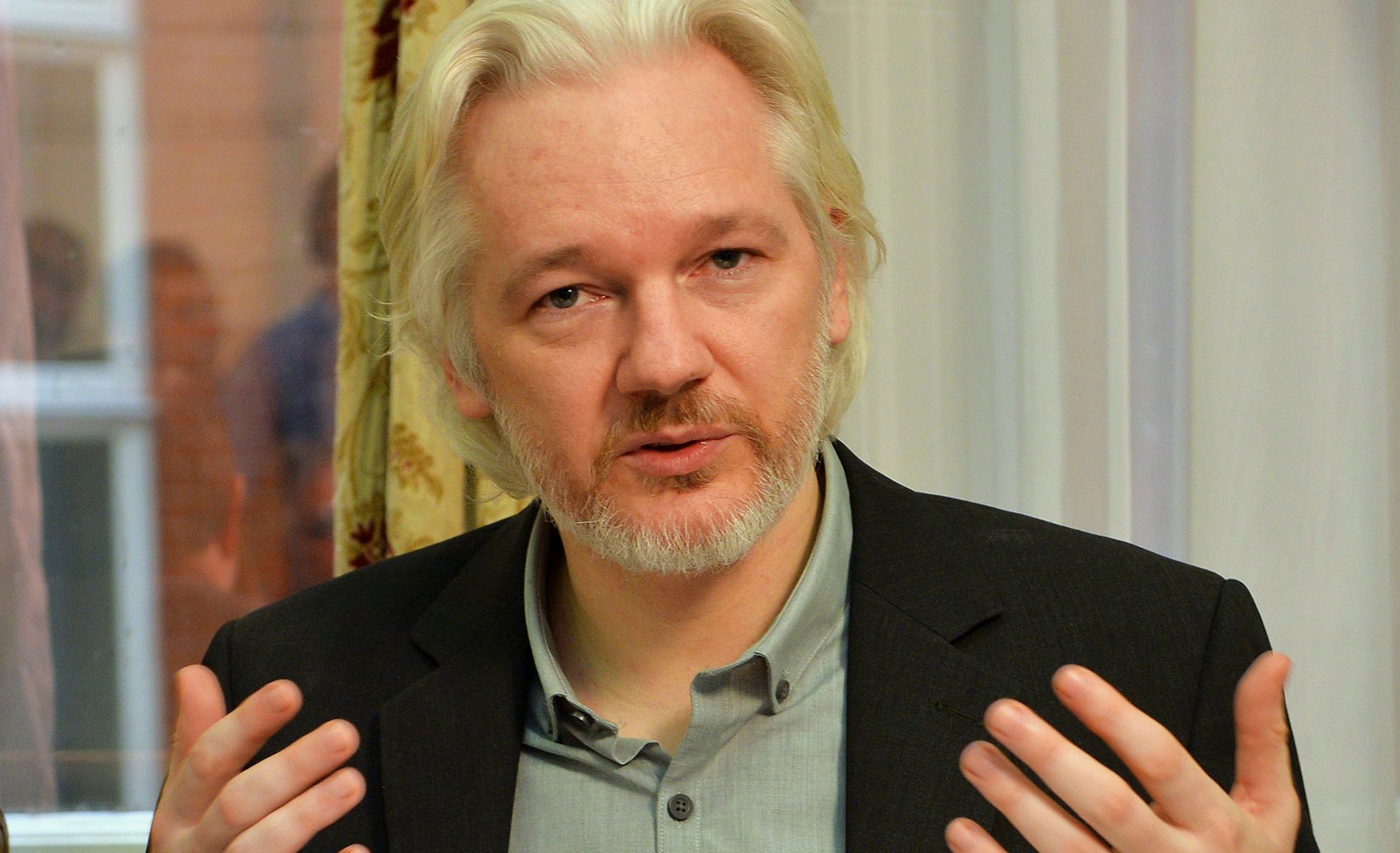Julian Assange giving a press conference at the Ecuadorian embassy in London, which he said he is leaving "soon"