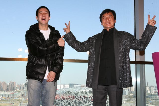 Jaycee and Jackie Chan take part in a press conference for Chan's concert at Beijing's Bird's Nest stadium in 2009
