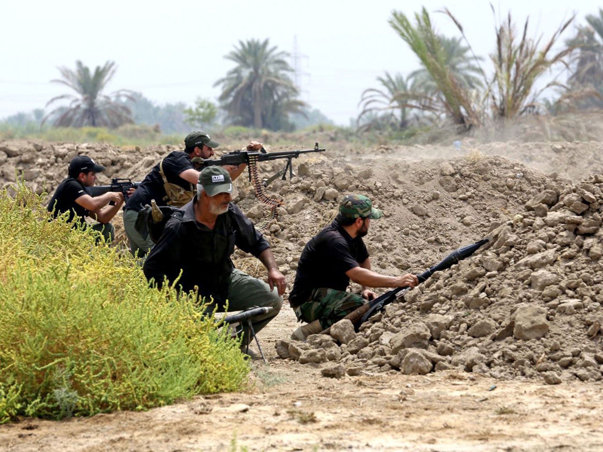 Iraqi Shia fighters prepare to fight Isis militants in Jurf Al Sakhar, 43 miles south of Baghdad (AP)