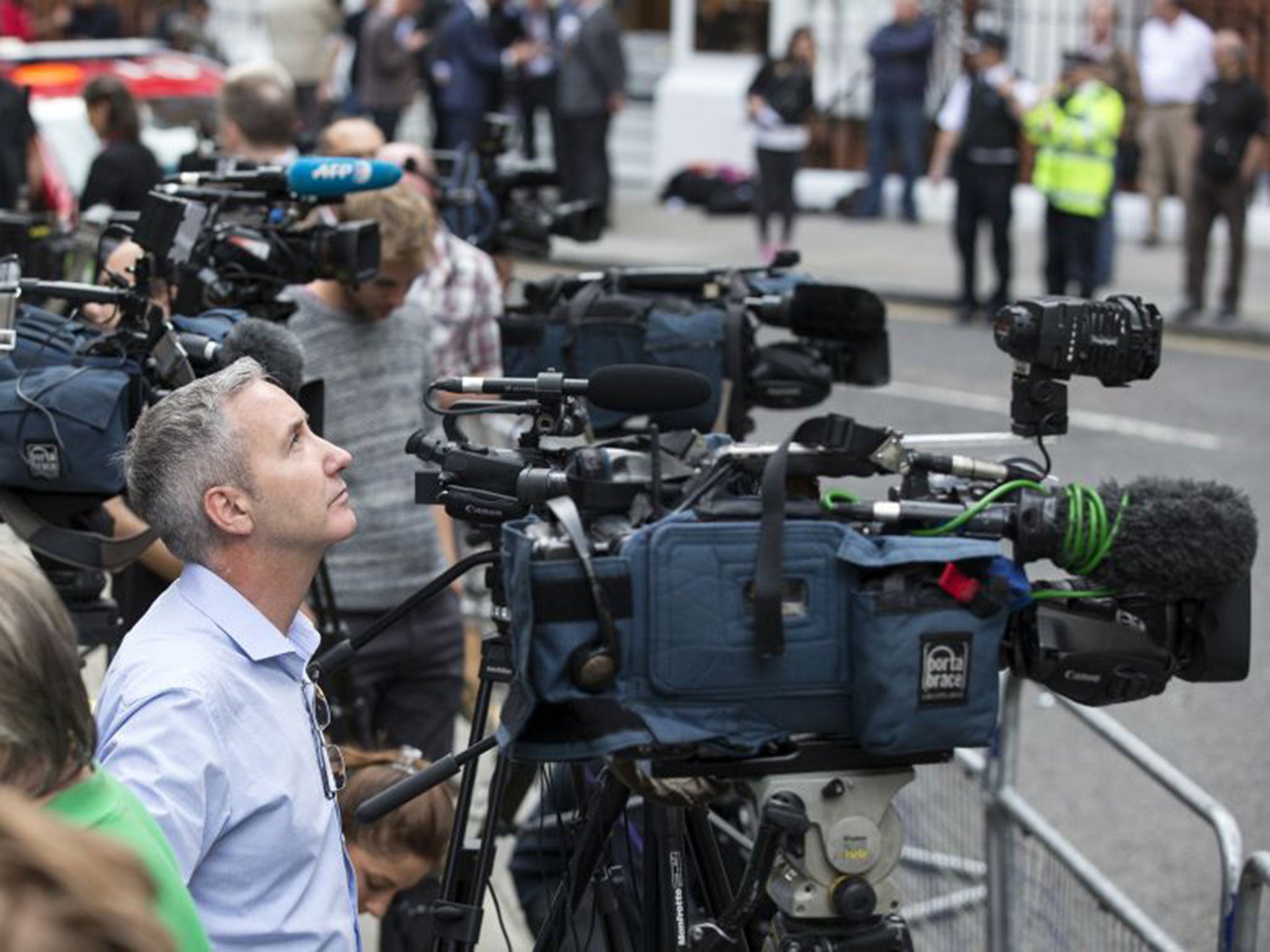 Members of the media outside the Ecuadorean embassy in London on Tuesday, where Julian Assange gave a press conference