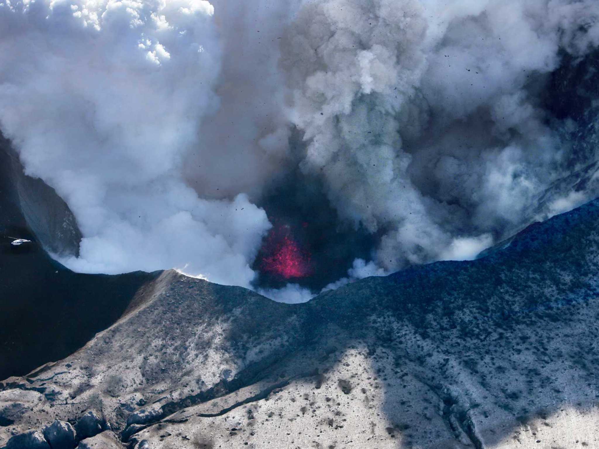 Smoke billows from the erupting volcano with fire in 2010