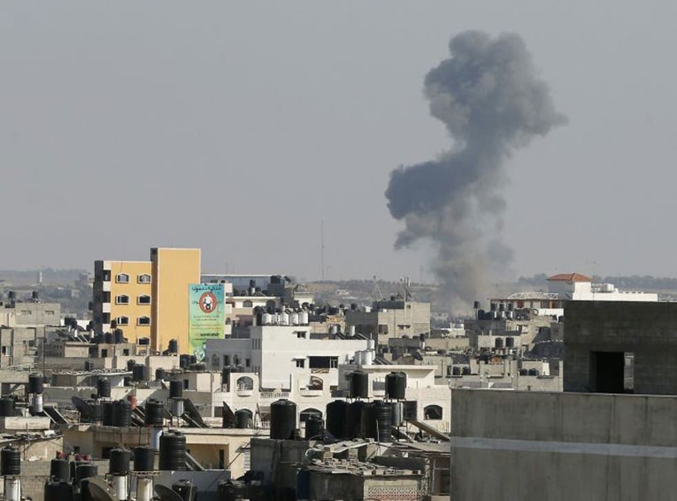 Smoke is seen after what witnesses said was an Israeli air strike in Gaza City August 19, 2014.