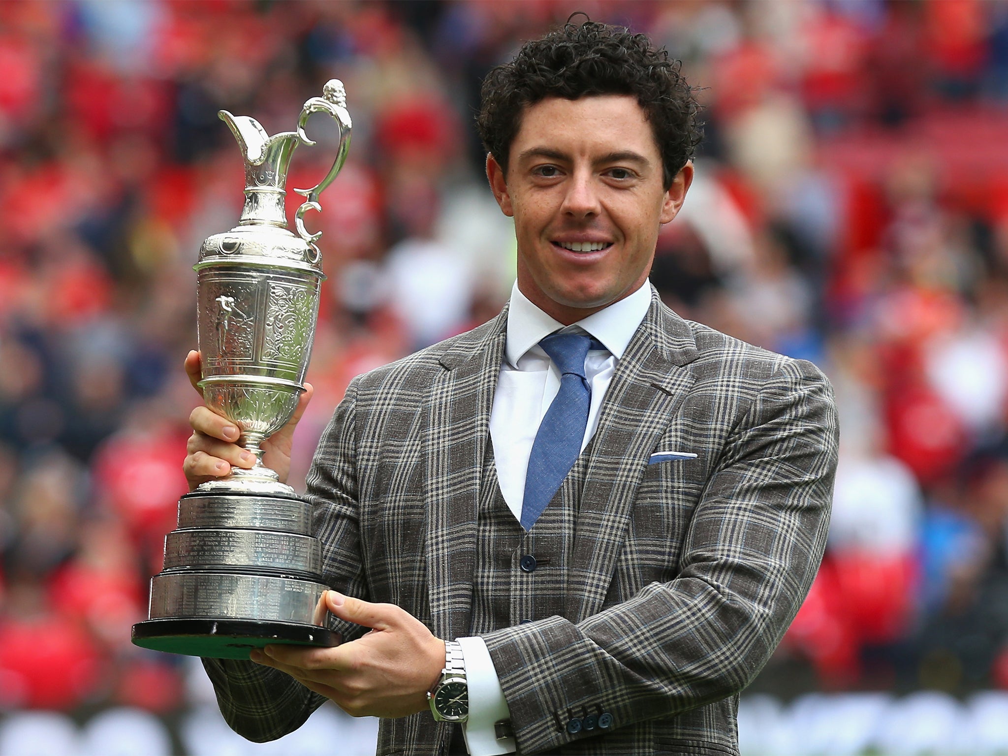 The Northern Irishman poses with the Open trophy at Old Trafford (Getty)