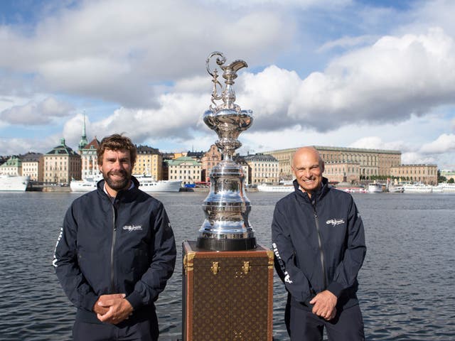 Iain Percy (left) and Torbjörn Törnqvist with the America’s Cup in the home they would like it to have, Stockholm