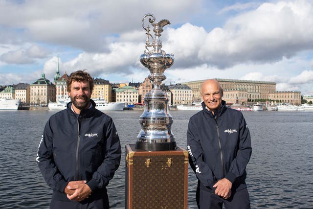 Iain Percy (left) and Torbjörn Törnqvist with the America’s Cup in the home they would like it to have, Stockholm