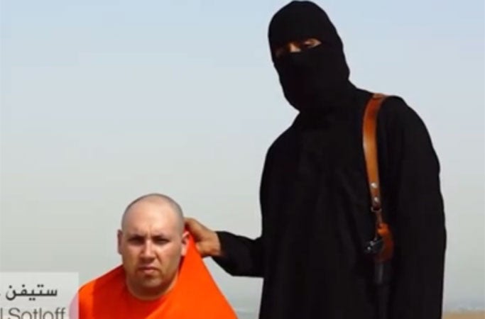 The militant with a man thought to be the journalist Steven Sotloff