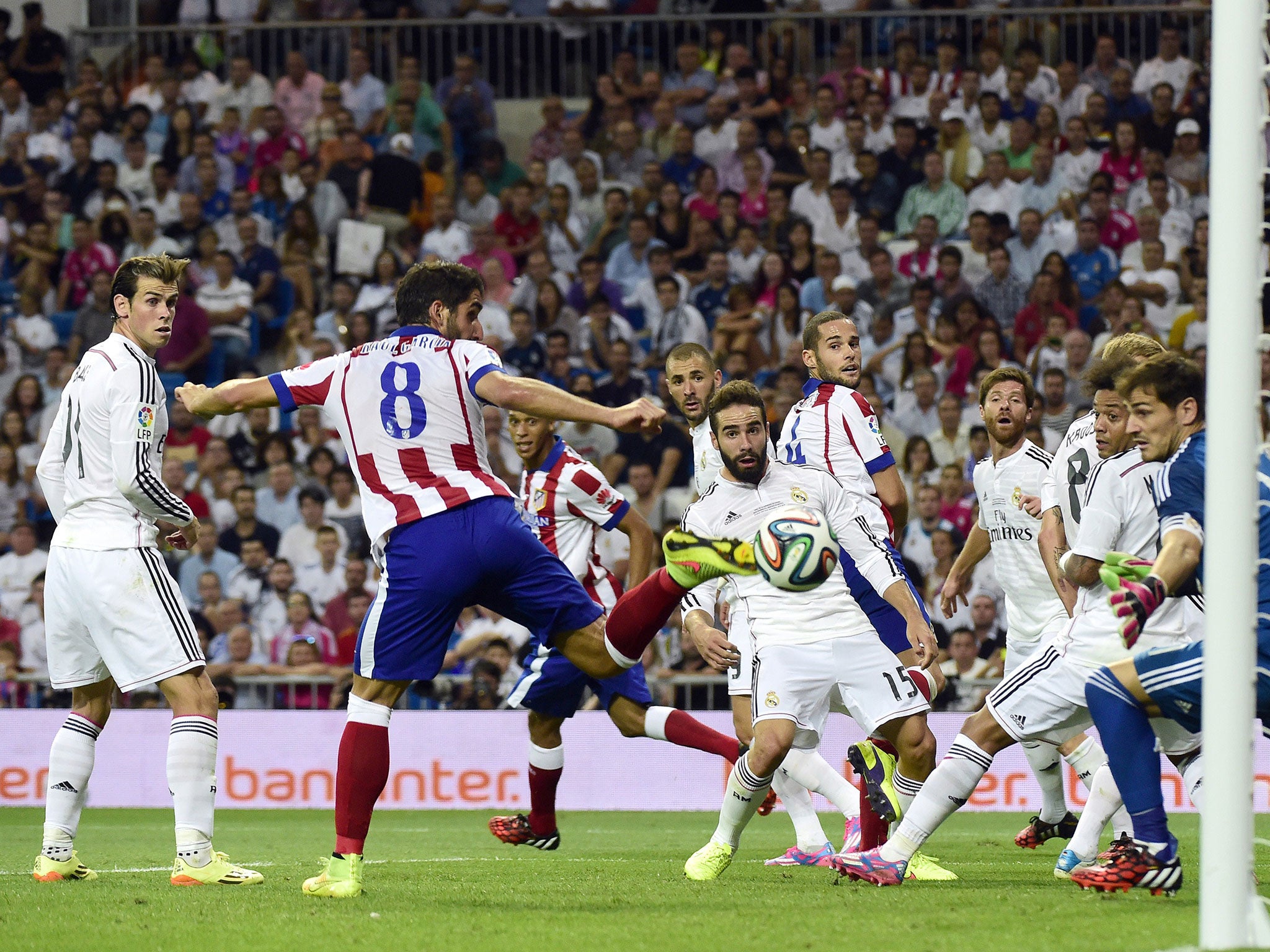 Real Madrid players react to Raul Garcia's late equaliser for Atletico Madrid
