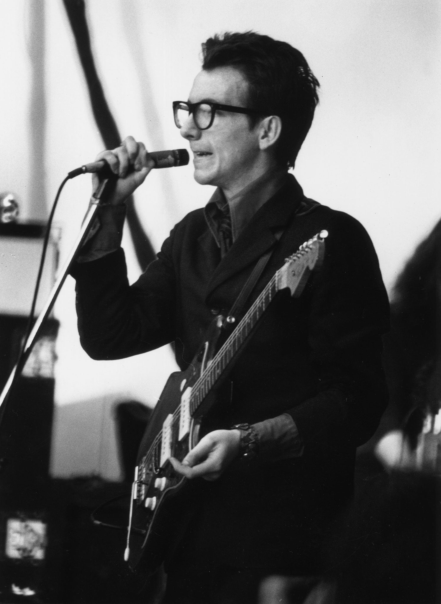 Elvis Costello performs on stage