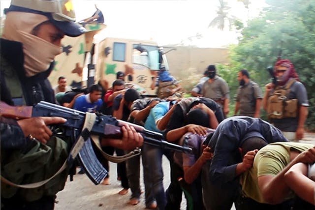 Jihadist militants leading away captured Iraqi soldiers in Tikrit, Iraq, in June