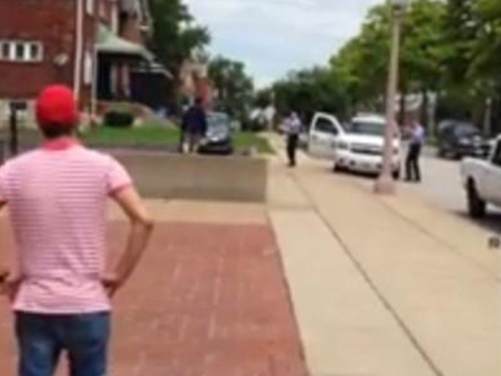 The man walked up onto the wall, walked away from police and then began to walk forwards towards them. Police then fired shots