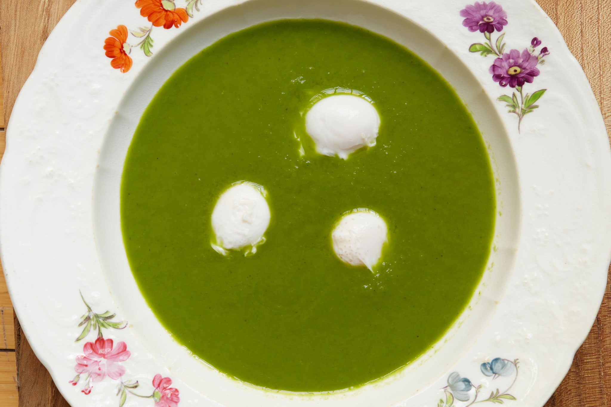 Parsley soup with poached quails' eggs