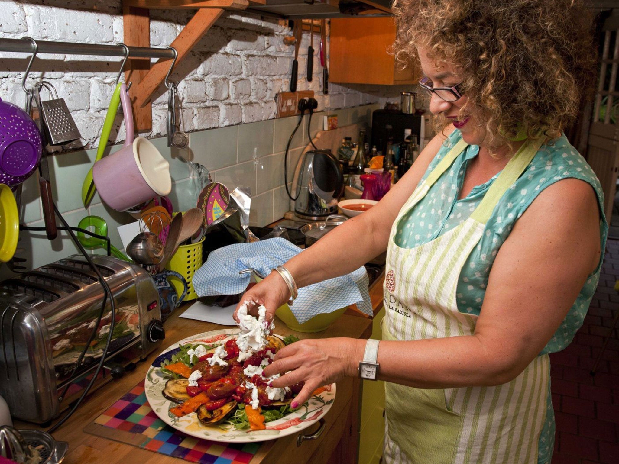 Pick of the bunch: Sudi Pigott puts together roasted tomatoes with peppers, aubergines and Labneh cheese for a tomato-inspired vegetarian main dish