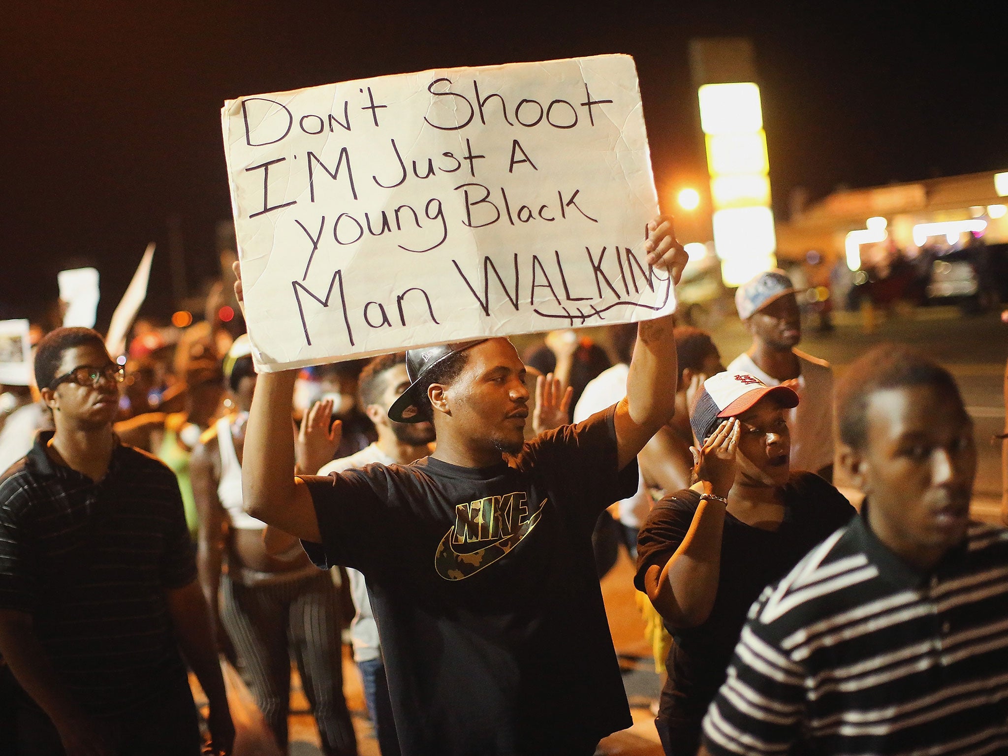 Demonstrators protest the killing of teenager Michael Brown on August 19, 2014 in Ferguson, Missouri.