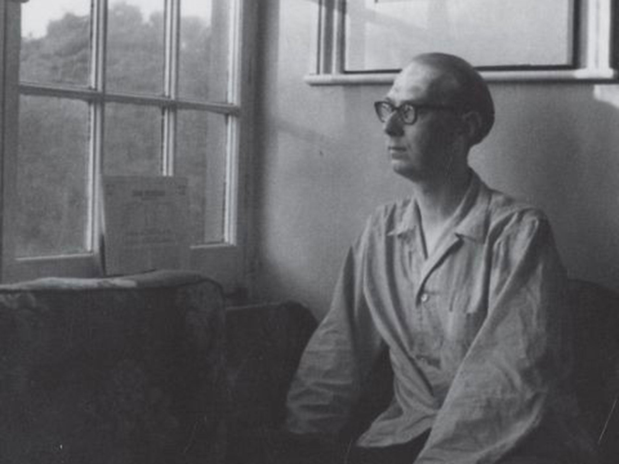 Poet’s corner: Philip Larkin at the venetian window of his home in 1958