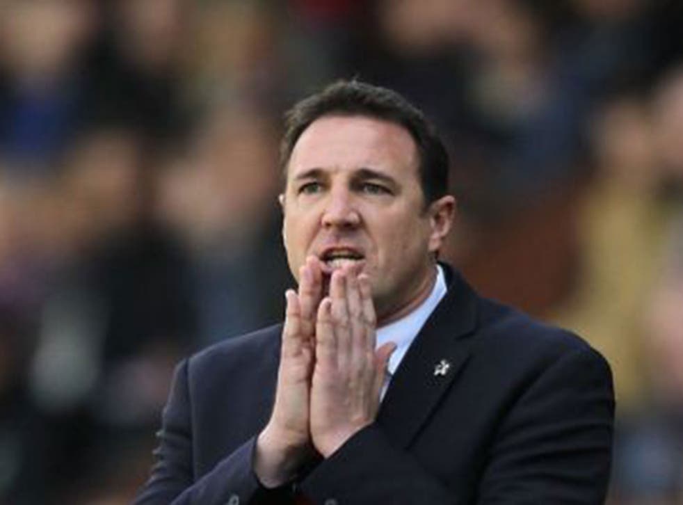 Cardiff City are pursuing what they consider to be a considerable overspend on player recruitment by former manager Malky Mackay 
