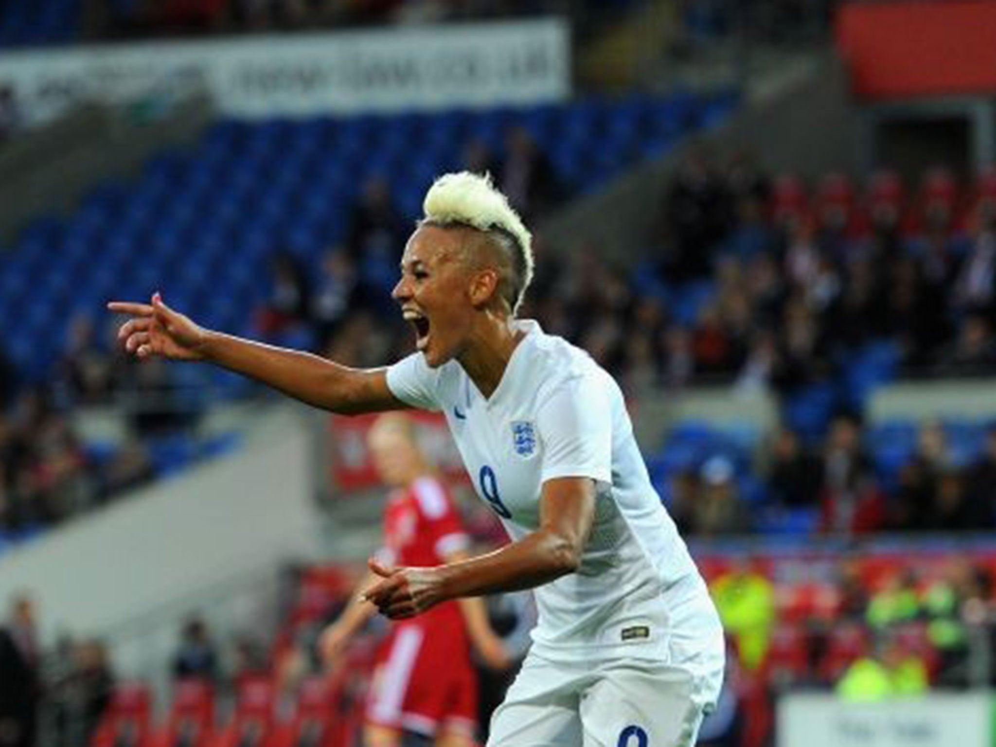 England forward Lianne Sanderson celebrates after scoring the fourth England goal during the FIFA 2015 Women's World Cup Group 6 Qualifier between Wales and England at Cardiff City Stadium on August 21, 2014 in Cardiff, Wales