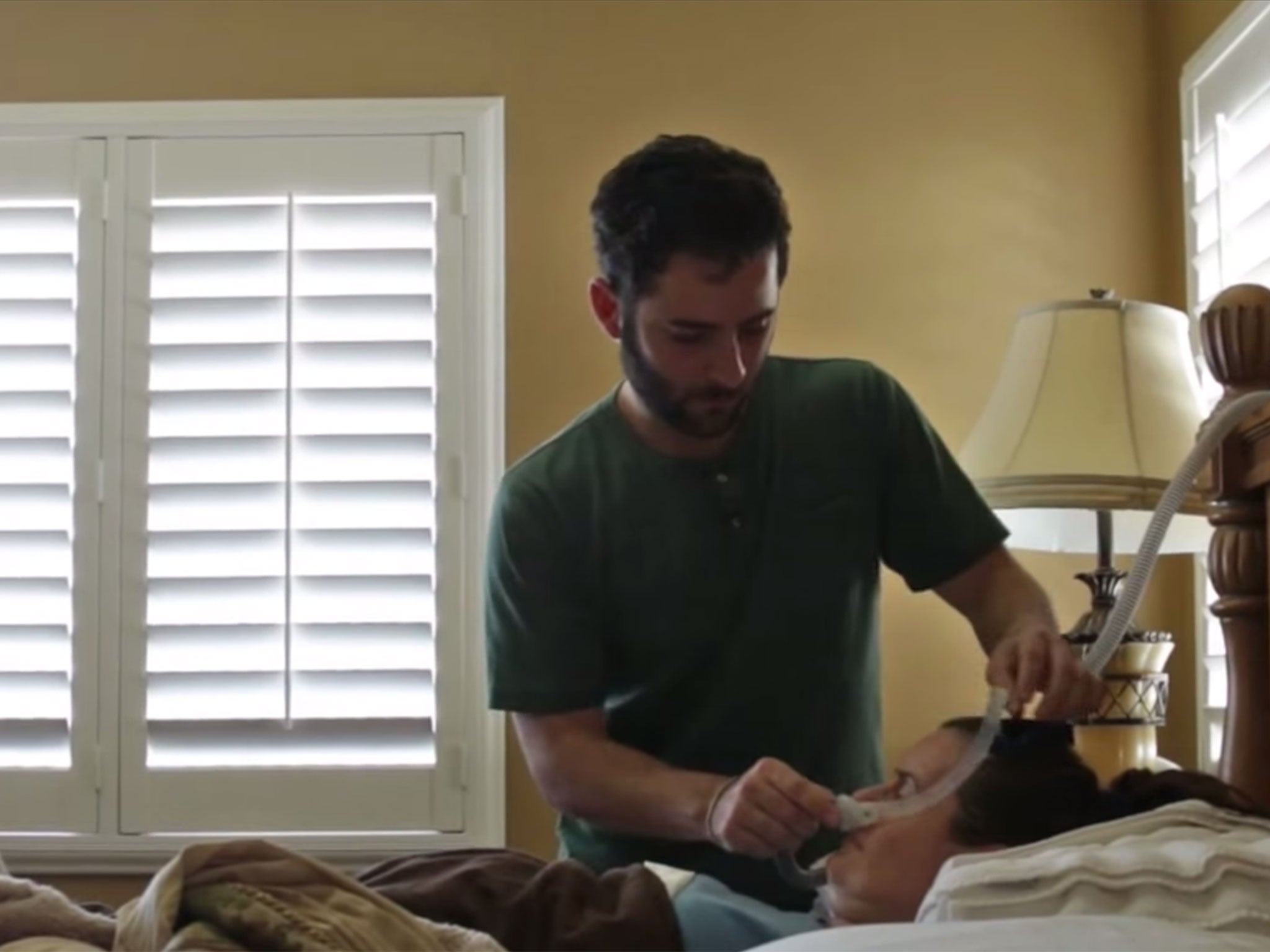 An ALS patient tends to his mother