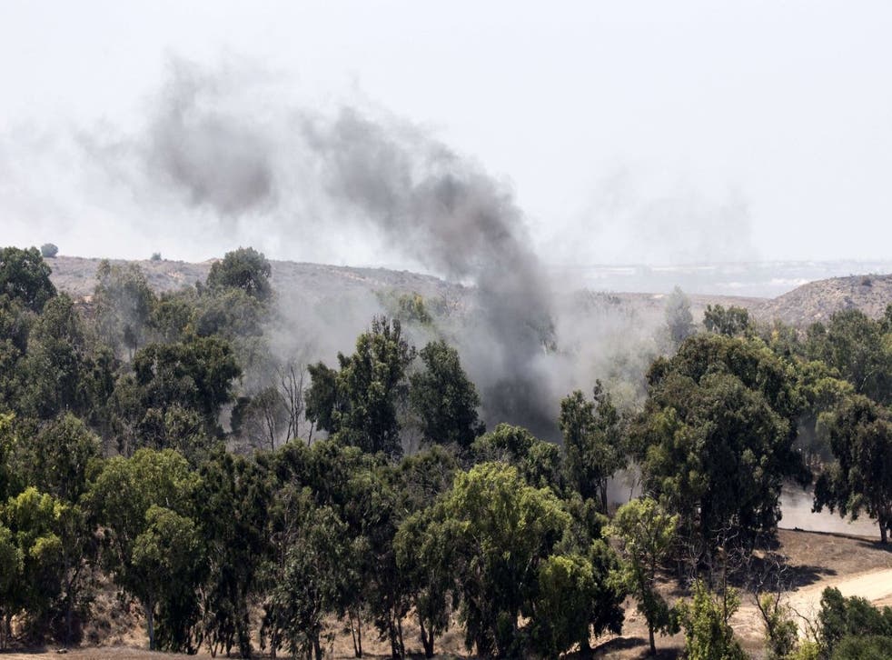 A picture taken from the southern Israeli border with the Gaza Strip shows smoke rising from the remains of a mortar fired by Hamas into Israel