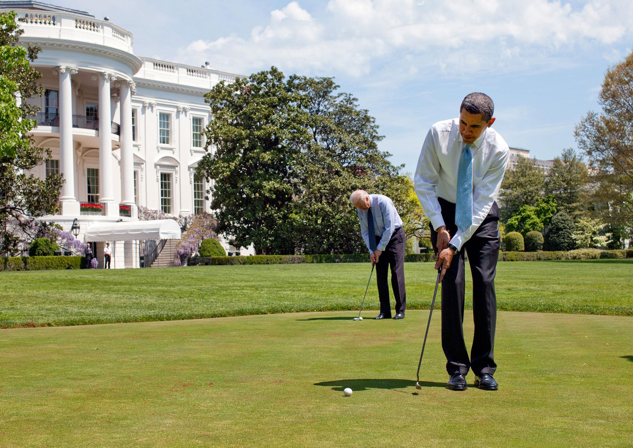 Barack Obama and Joe Biden putt on the White House putting green