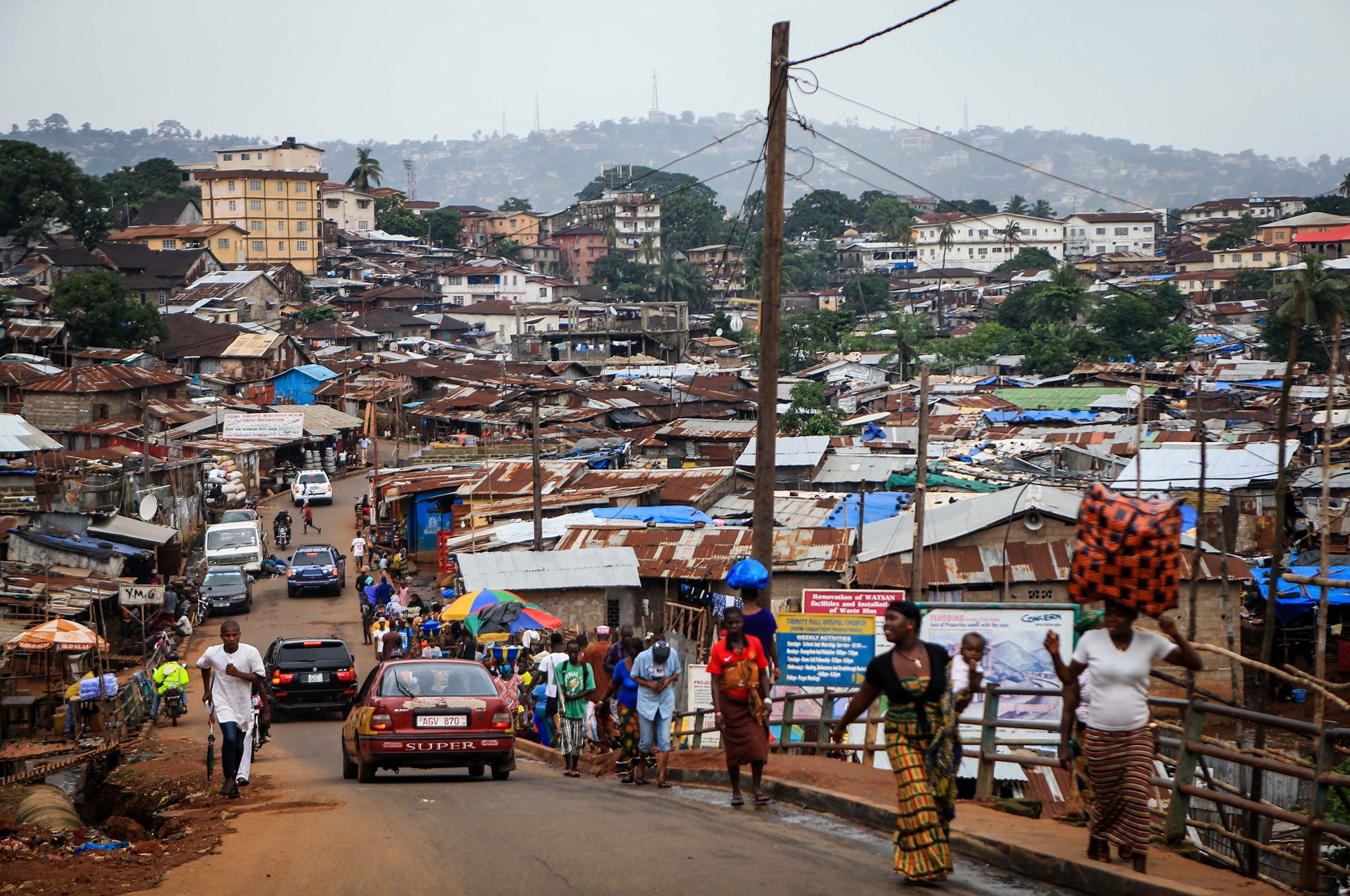 Day-to-day life in a slum in the Ebola-affected Freetown, capital of Sierra Leone, where mining had been thriving before the outbreak