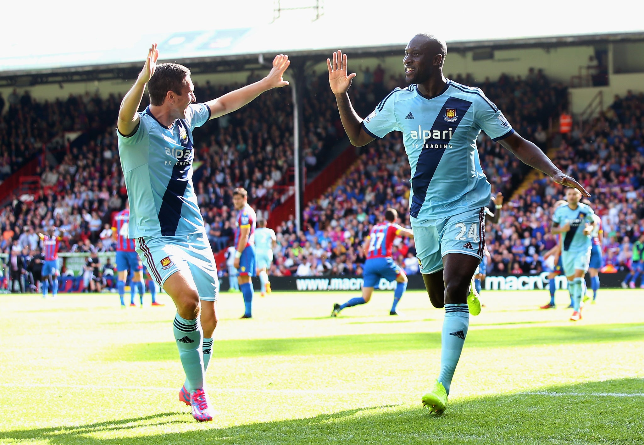 Carlton Cole (right) celebrates his goal for West Ham last weekend