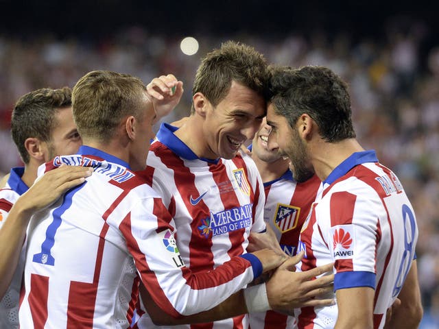 Mario Mandzukic celebrates after Atletico Madrid beat rivals Real Madrid in the Spanish Super Cup