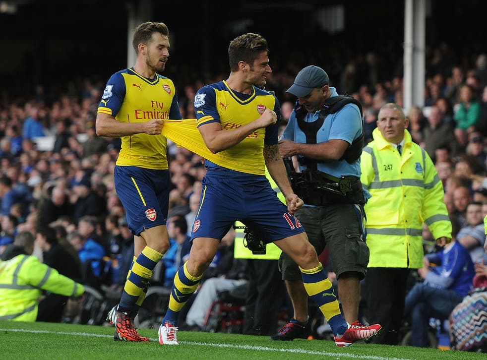 Olivier Giroud celebrates after his late goal saved Arsenal a point at Goodison Park