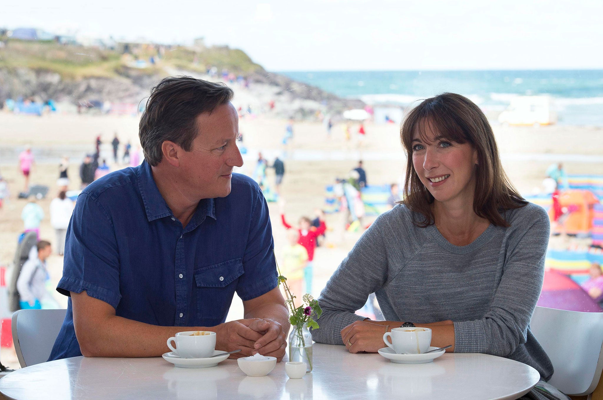 David Cameron and his wife Samantha pose for a photograph during their holiday in Polzeath, Cornwall