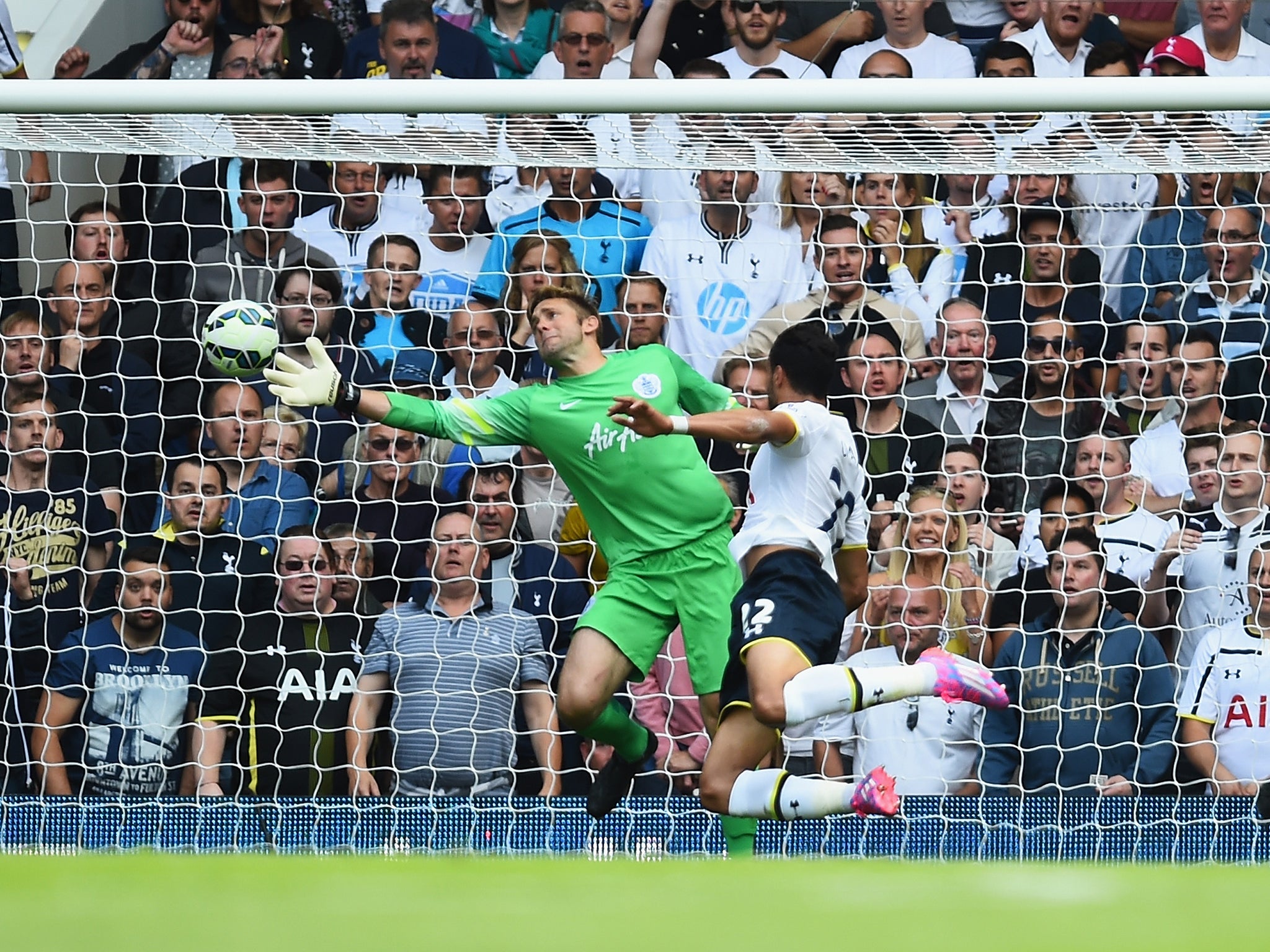 Nacer Chadli of Spurs heads past Robert Green of QPR to score his team's third goal