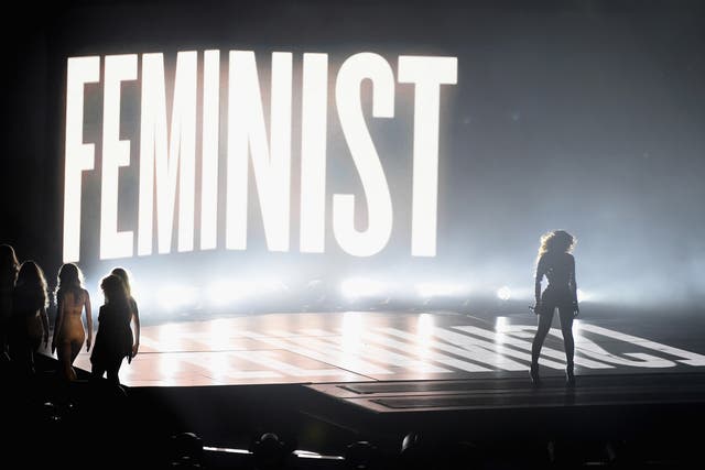 Beyonce performs in front of a Feminist sign at the MTV VMAs 2014