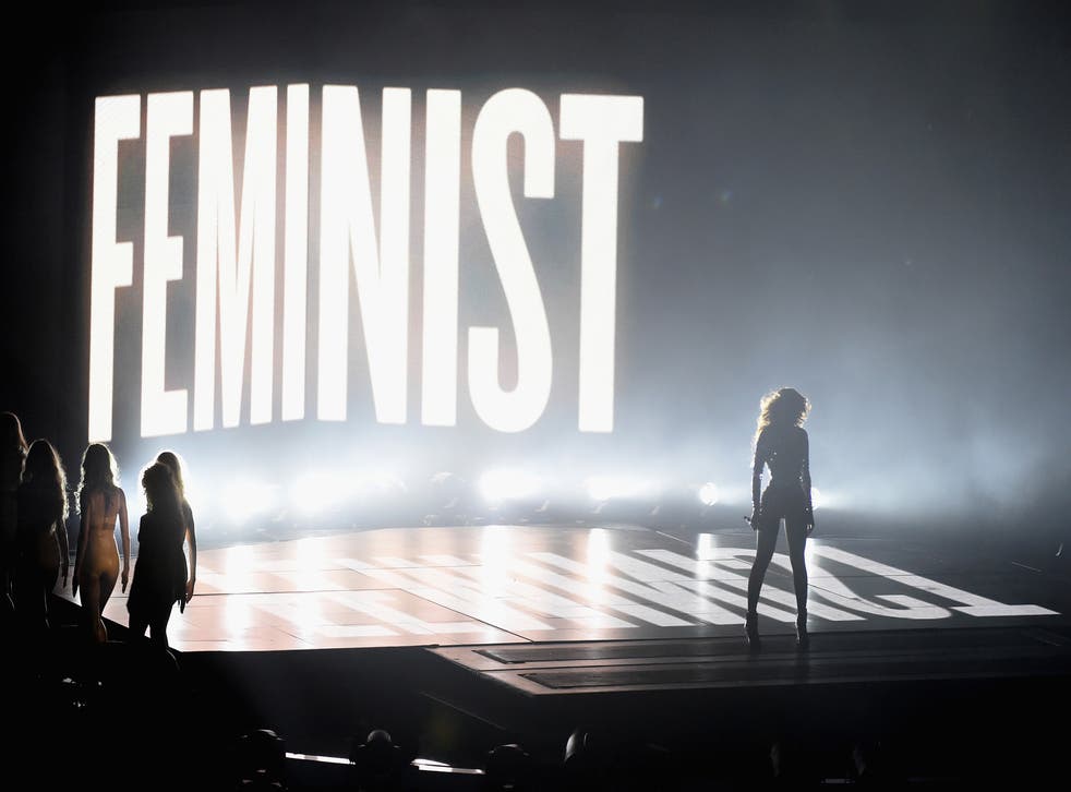 Beyonce performs in front of a Feminist sign at the MTV VMAs 2014