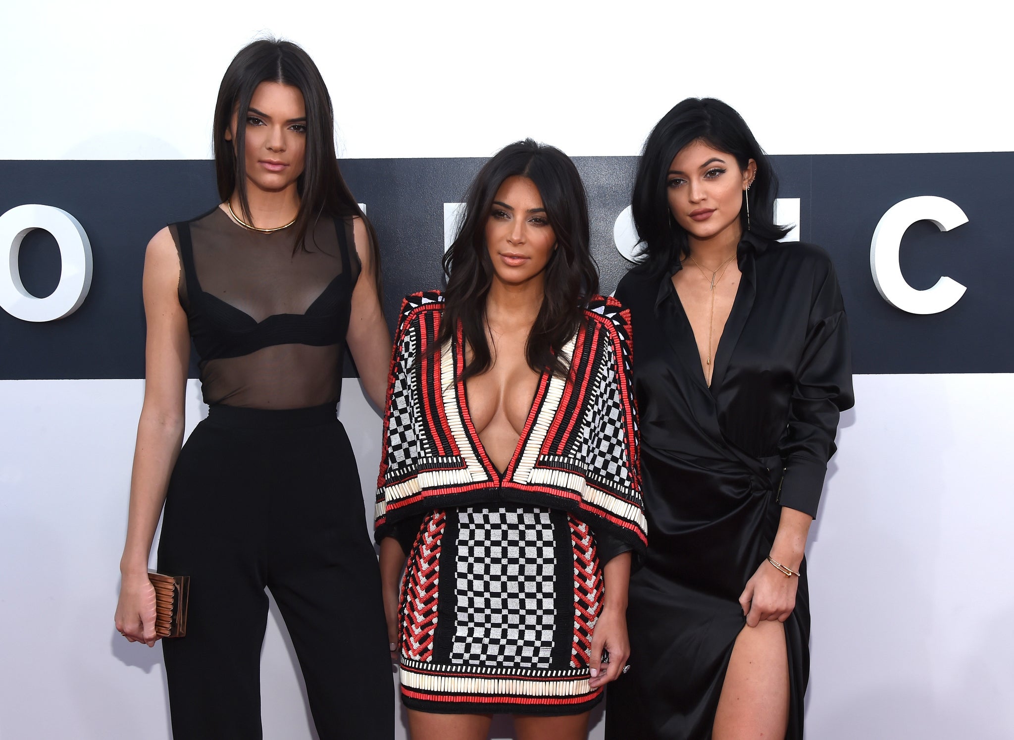 VMAs: The Kardashian-Jenner sisters have come under fire for texting through a silent tribute to Ferguson
